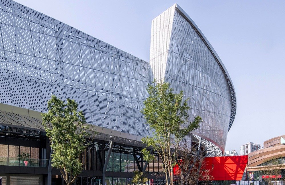 Perforated metal facade panels used in the Chongqing sports venue renovation