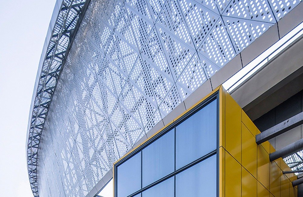 Perforated metal facade detailing at the renovated Chongqing sports venue