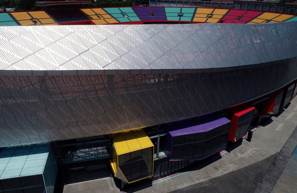 Perforated metal facade installation for the Chongqing sports venue renovation
