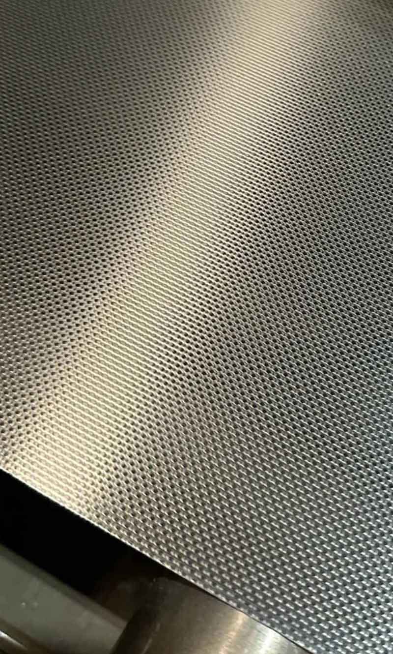 Embossed metal sheet with customized surface patterns for architectural applications