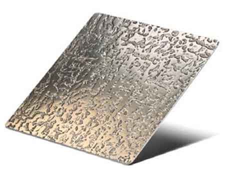 Etched stainless steel facade panel with decorative engraved surface pattern
