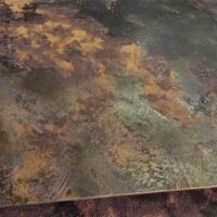 Patina finish stainless steel with a weathered metallic surface for architectural and interior applications