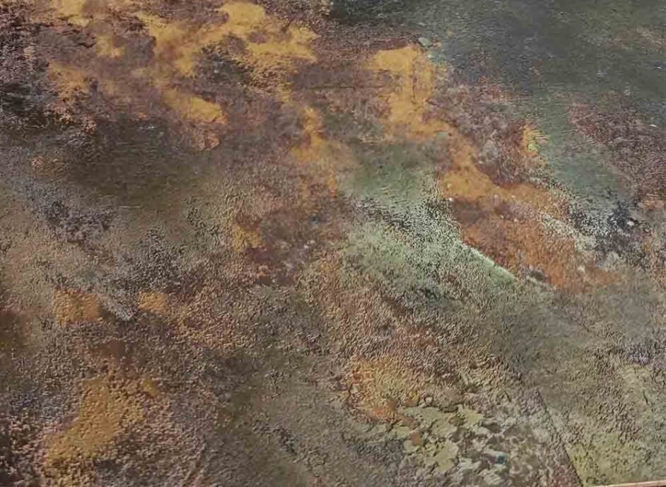 Patina finish stainless steel with a weathered metallic surface for architectural and interior applications