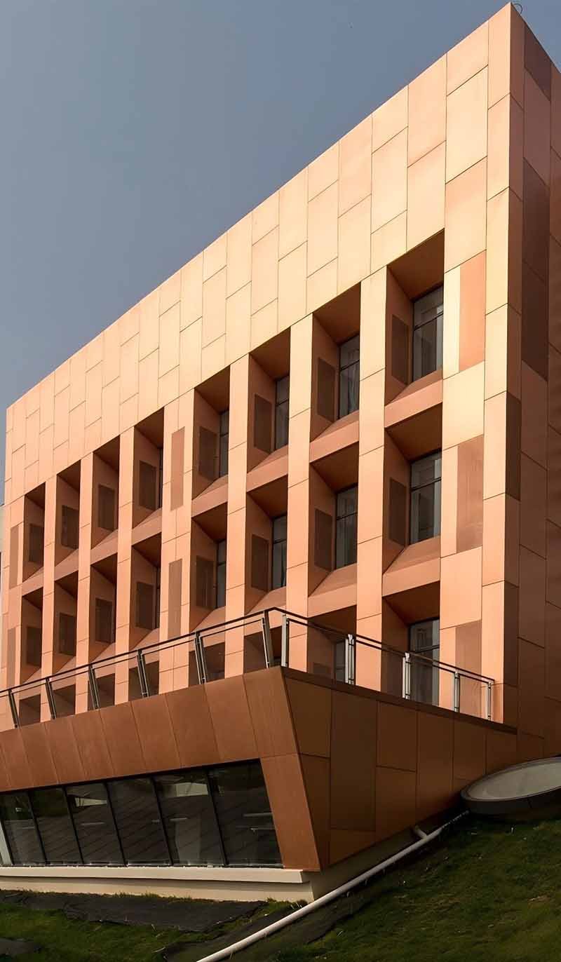 Architectural metal facade cladding project featuring customized exterior panel installation