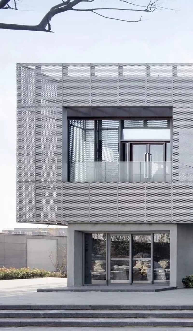 Architectural metal facade and cladding system featuring modern design and clean lines