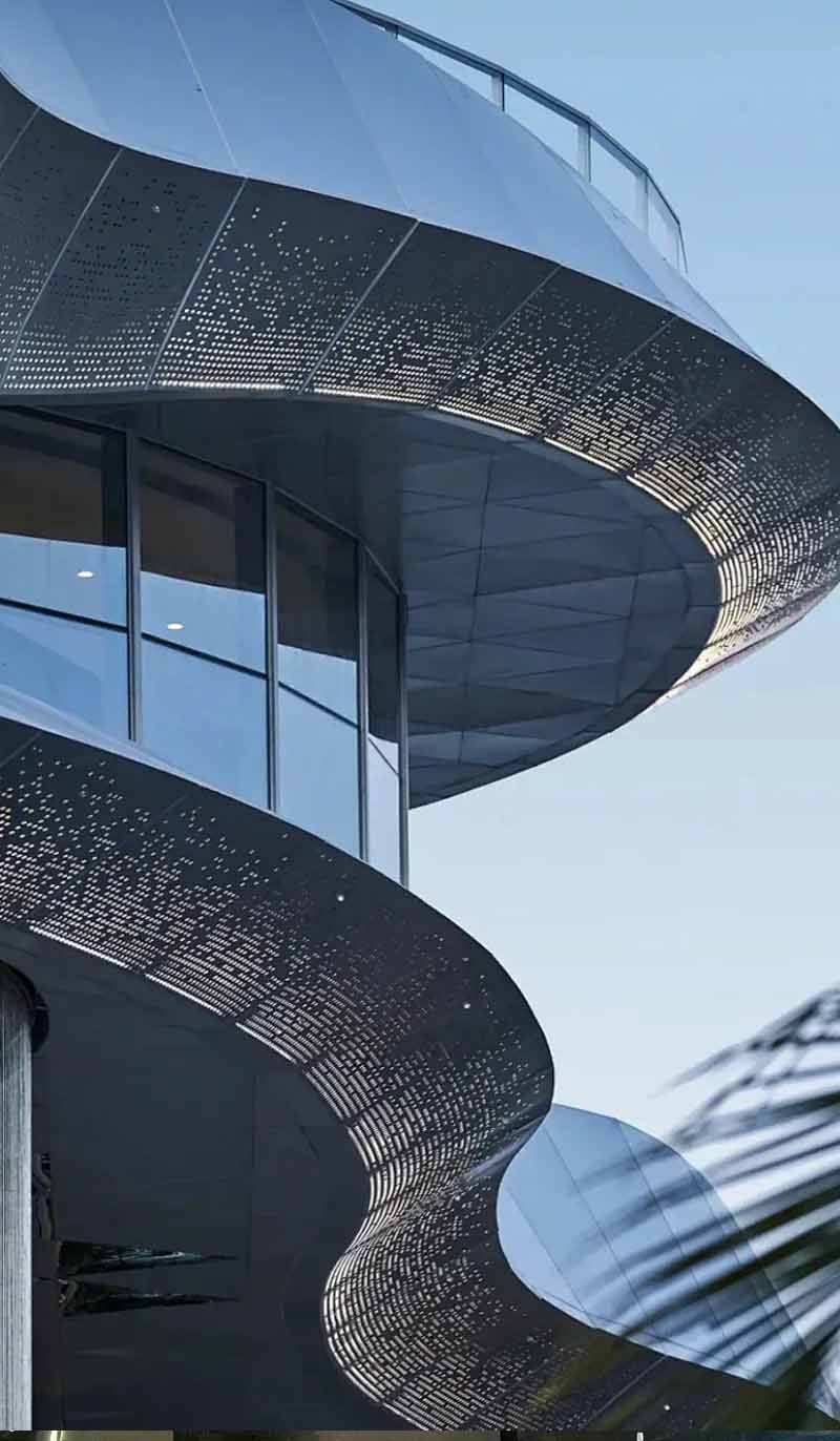 Custom suspended metal ceiling system applied in an architectural interior project