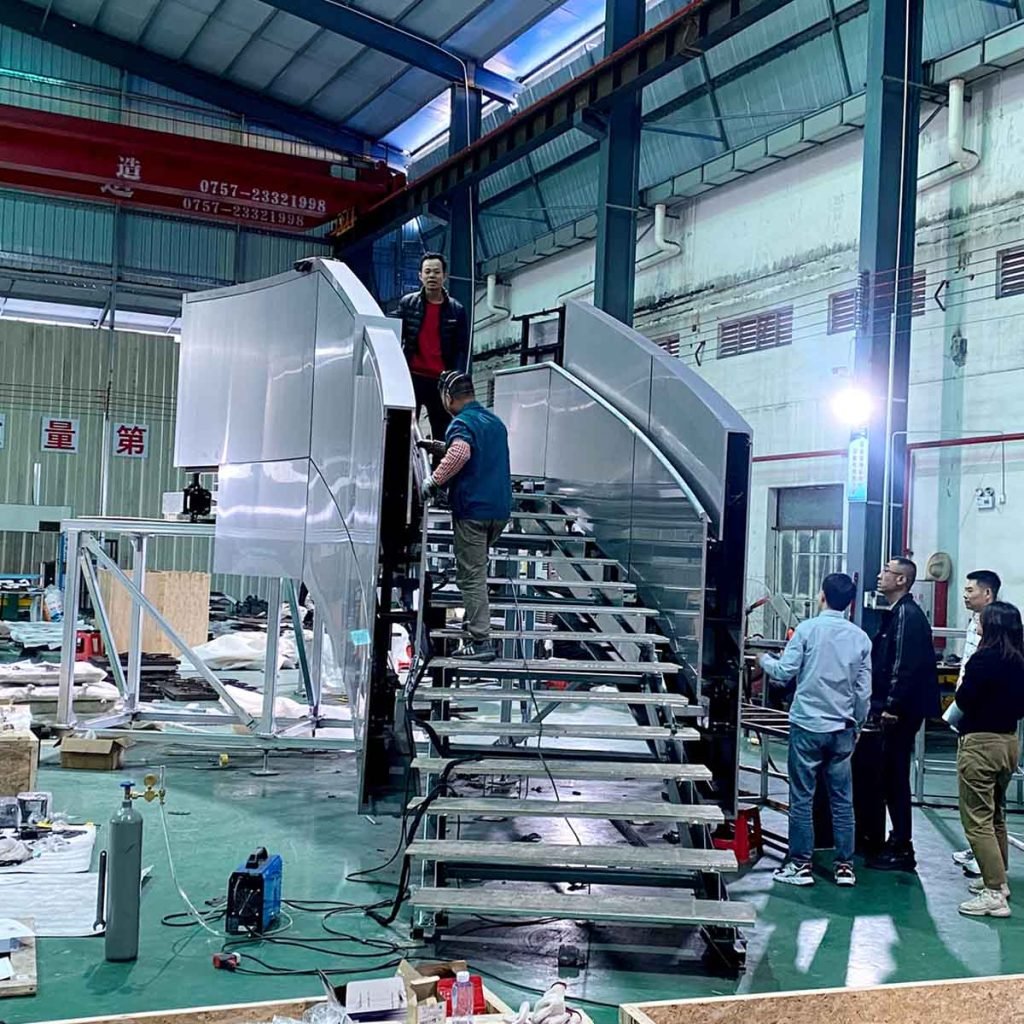 Custom metal fabrication and staircase assembly in workshop