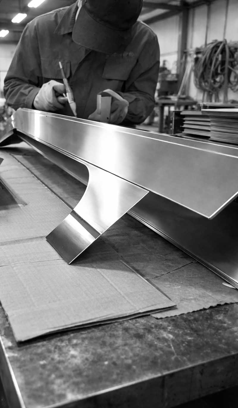 Custom elevator wall cladding for stainless steel interior doors and panels