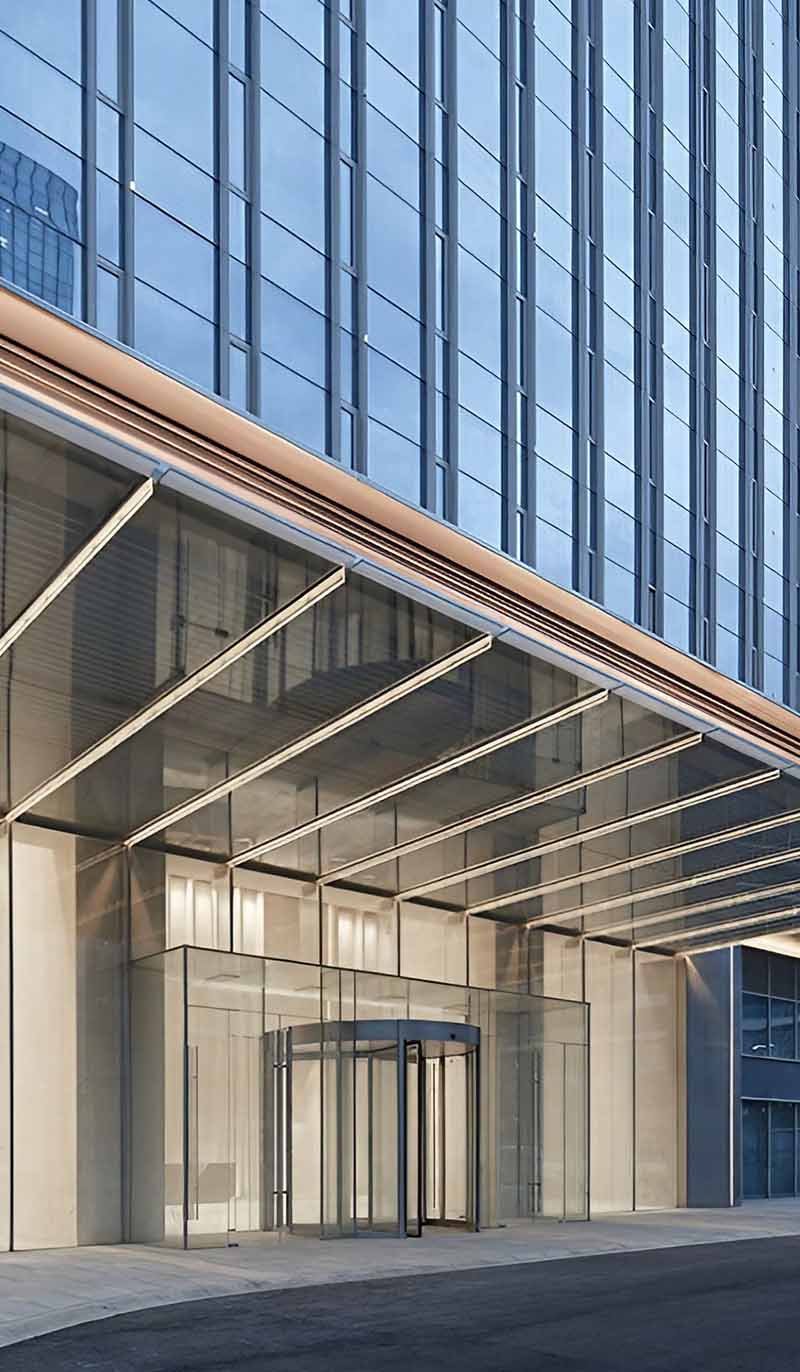 Custom glass canopy designs with varied stainless steel frame configurations