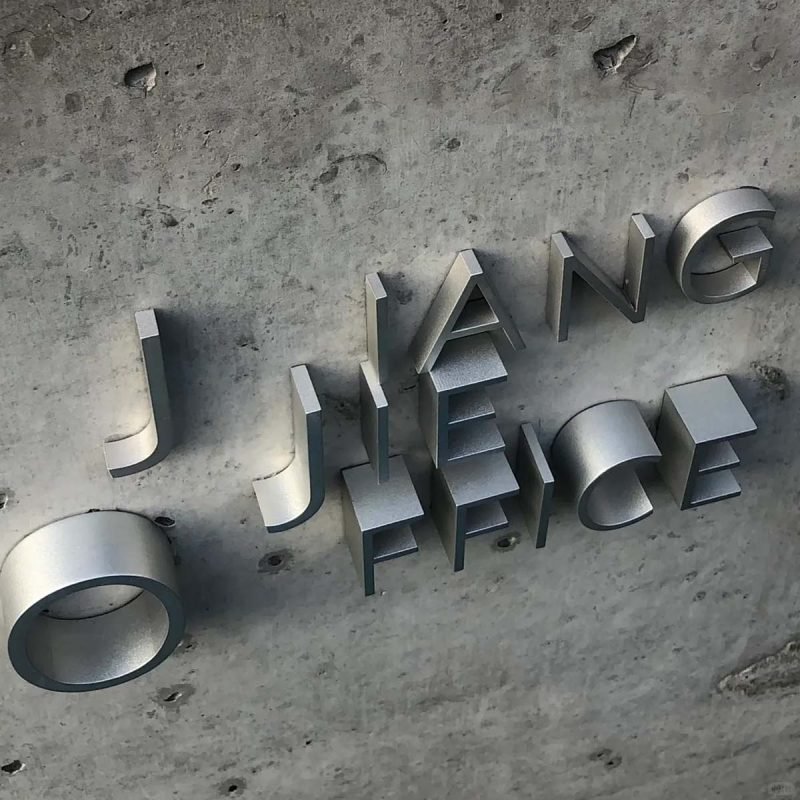 Customized stainless steel signage for architectural branding