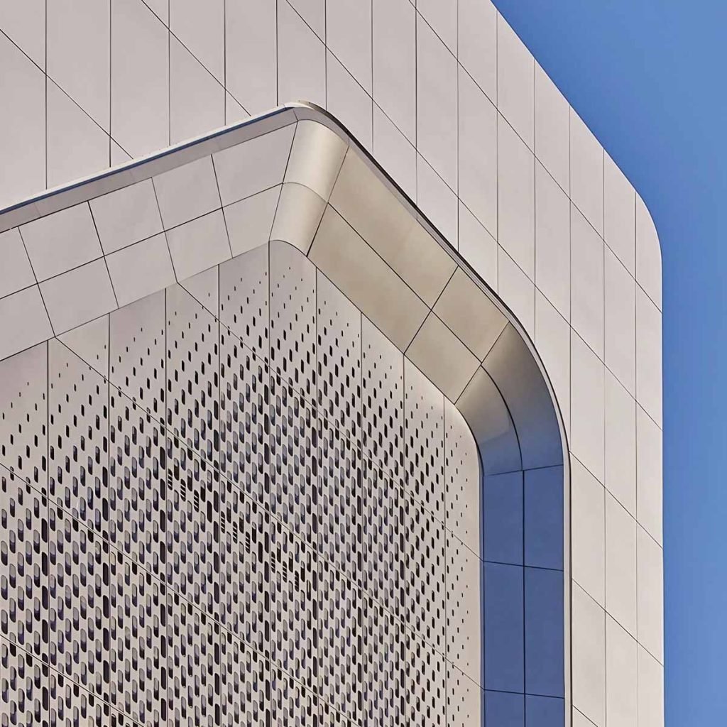 Laser-cut patterned metal facade panels for architectural cladding systems