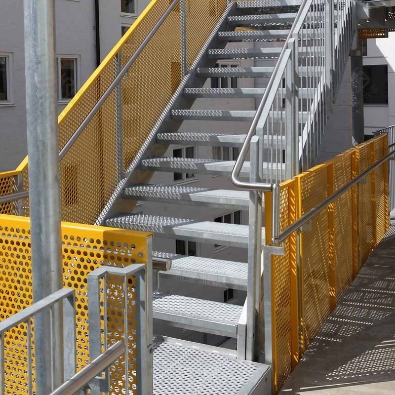 Custom perforated metal railing panels for architectural balconies and stairs