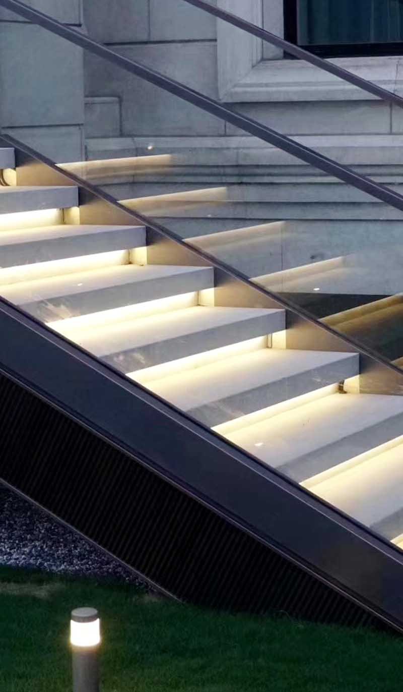 Custom glass architectural railing and balustrade system for a modern building