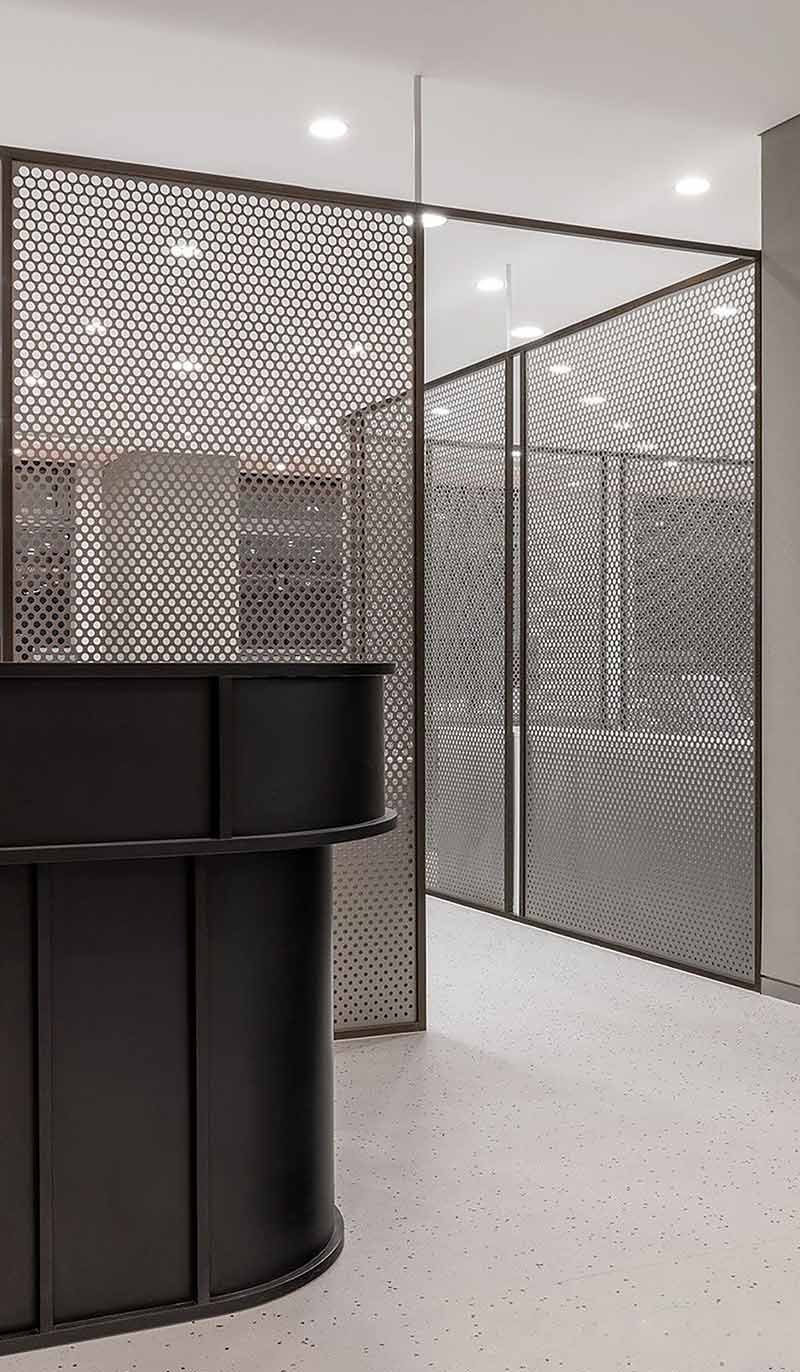 Architectural metal divider screen project with custom fabricated panels for interior space separation