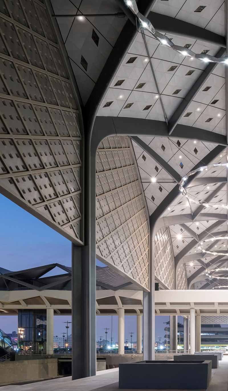 Custom metal roofing with a wide-span canopy for airport and railway station architecture