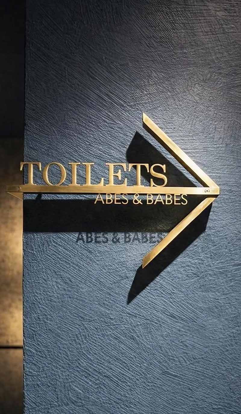 Custom stainless steel signage solution featured in an architectural project