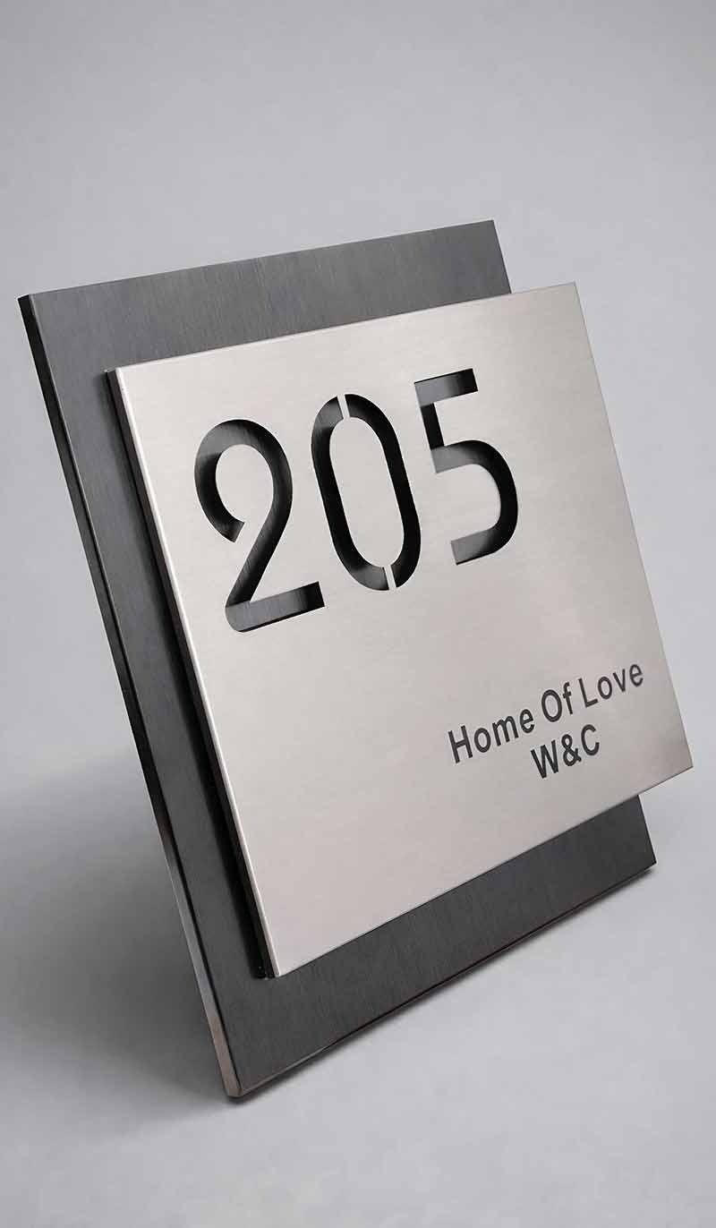 Customized stainless steel signage for architectural project branding