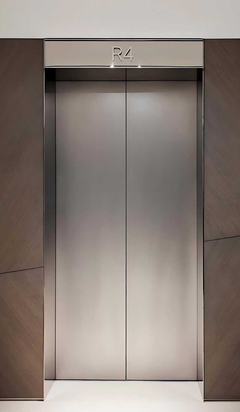 Custom stainless steel elevator door panels for modern interior spaces