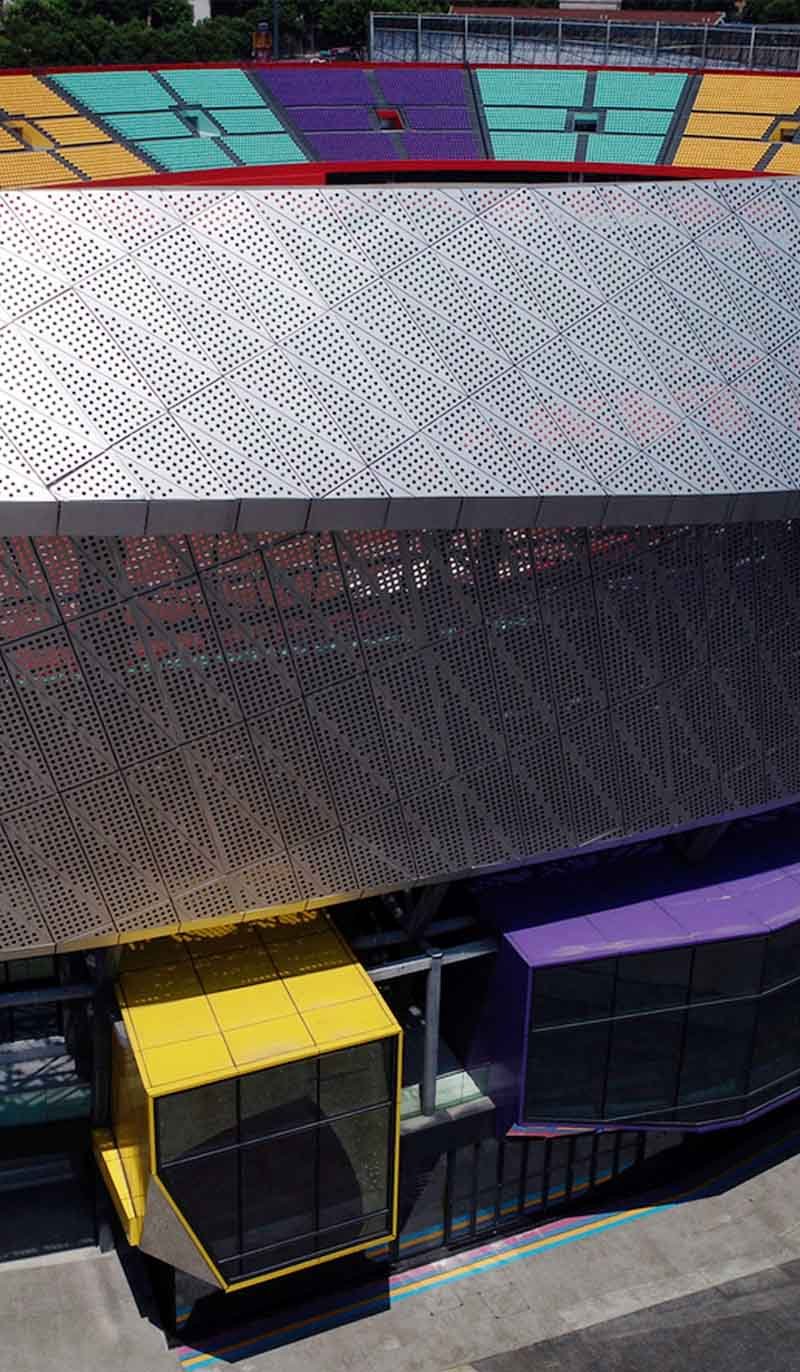 Perforated metal facade by TBK Metal Australia on modern architectural building exterior with aluminium cladding panels