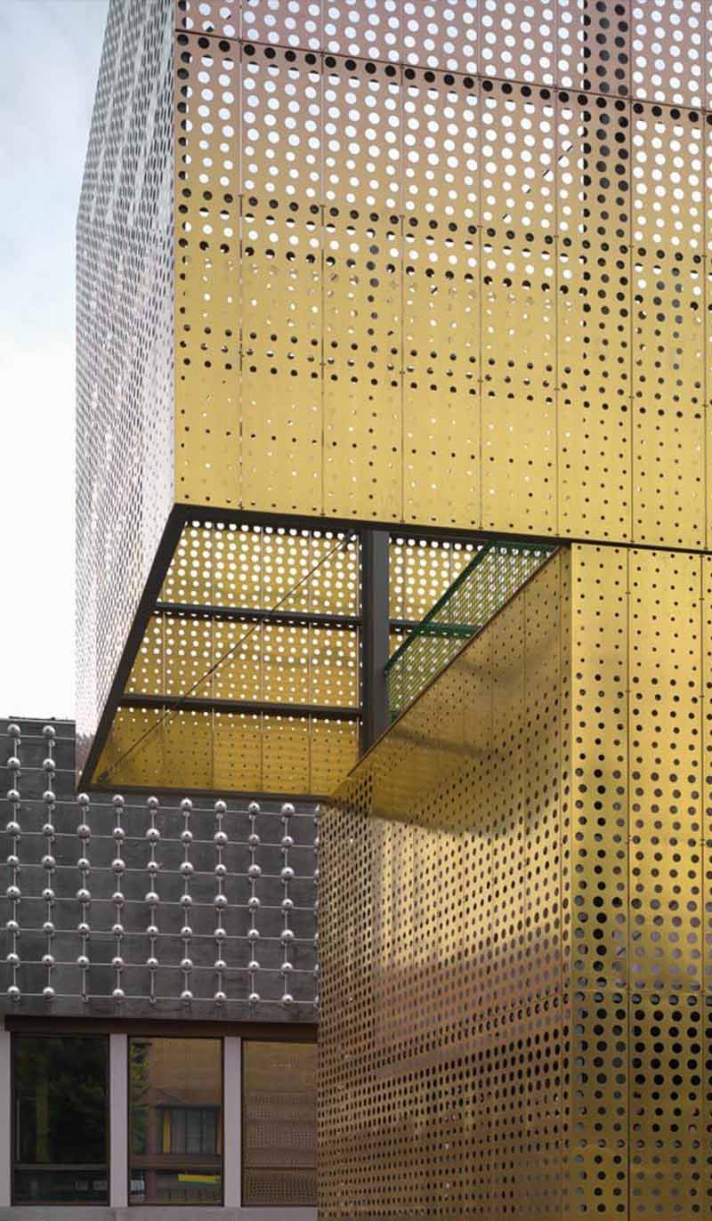 Perforated metal facade by TBK Metal Australia installed on contemporary building exterior with aluminium cladding panels