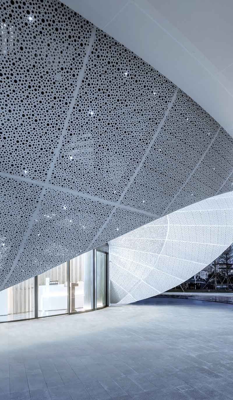 Perforated metal facade by TBK Metal Australia featuring aluminium cladding panels on modern architectural building exterior