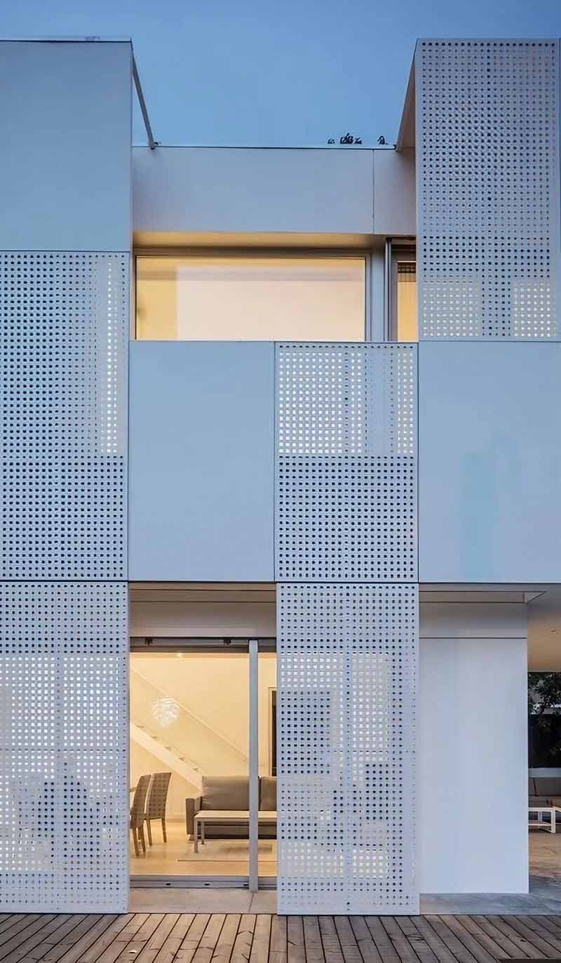 Perforated metal facade by TBK Metal Australia featuring aluminium cladding panels on contemporary architectural building exterior