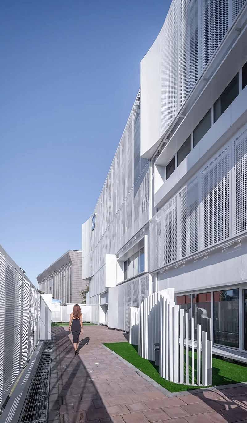Perforated metal facade by TBK Metal Australia showcasing aluminium cladding panels on modern architectural building exterior
