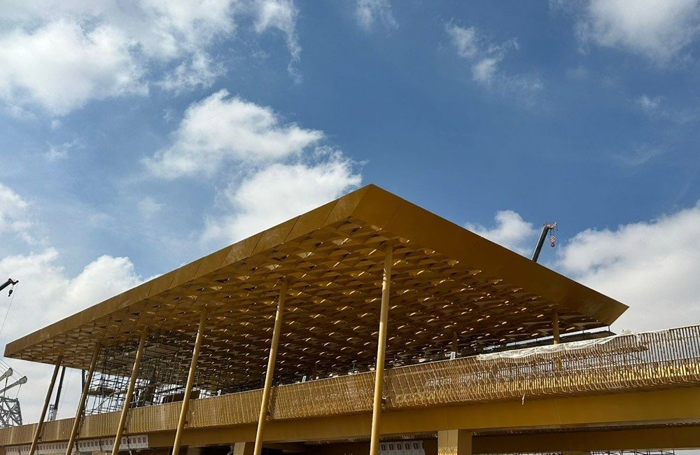 Sports Boulevard Riyadh pedestrian bridge facade installation with custom metal canopy by TBK Metal