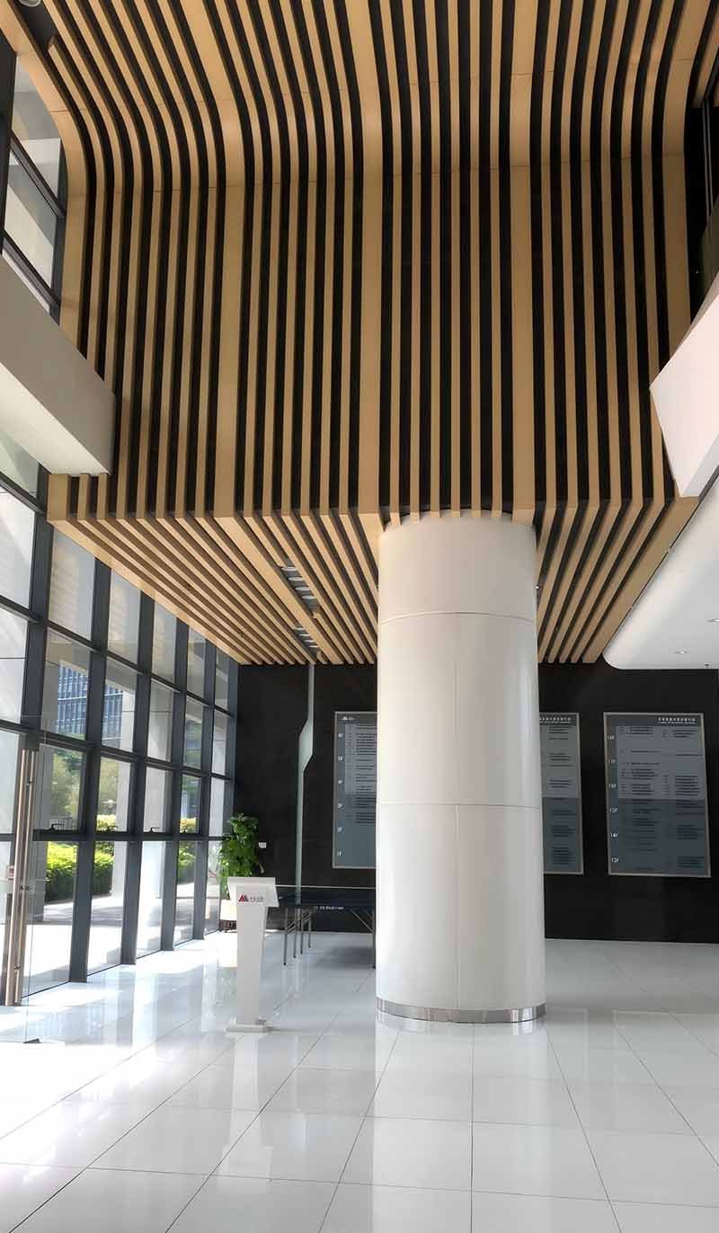 Aluminium linear metal ceiling system applied in a modern architectural interior project