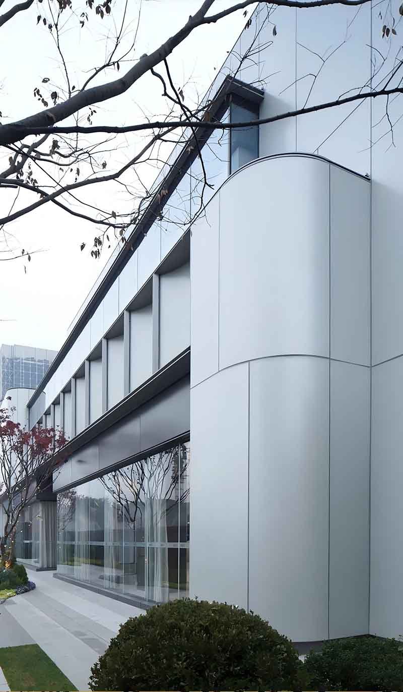 Decorative aluminium composite facade panels on modern commercial building exterior