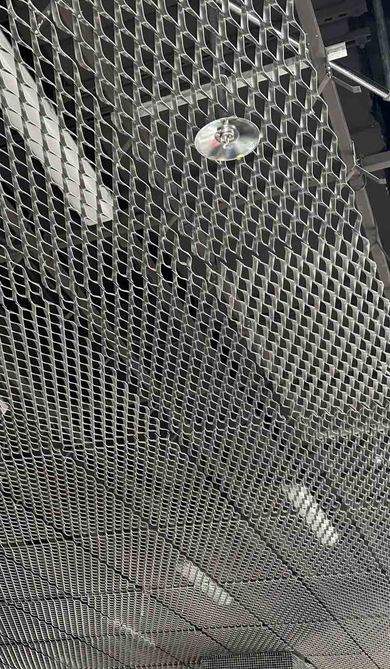 Expanded aluminium mesh ceiling panels installed in a modern architectural interior project