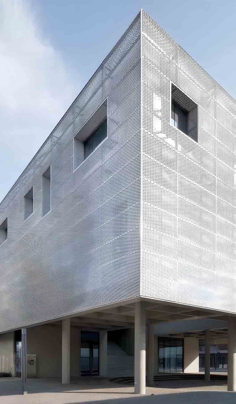 Expanded metal facade cladding panels featured in a modern architectural exterior project