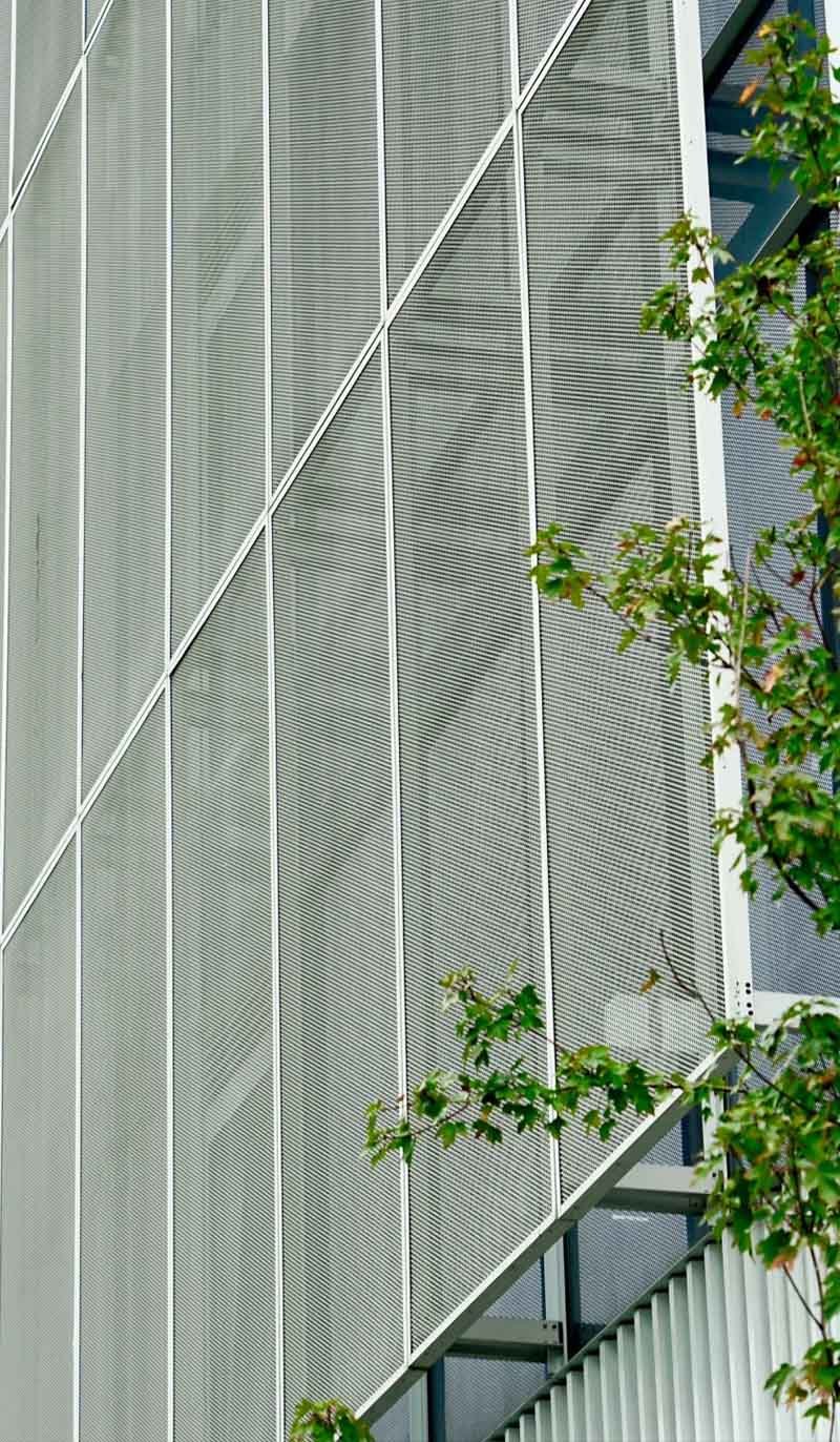 Expanded metal mesh cladding facade panels used in a contemporary building project