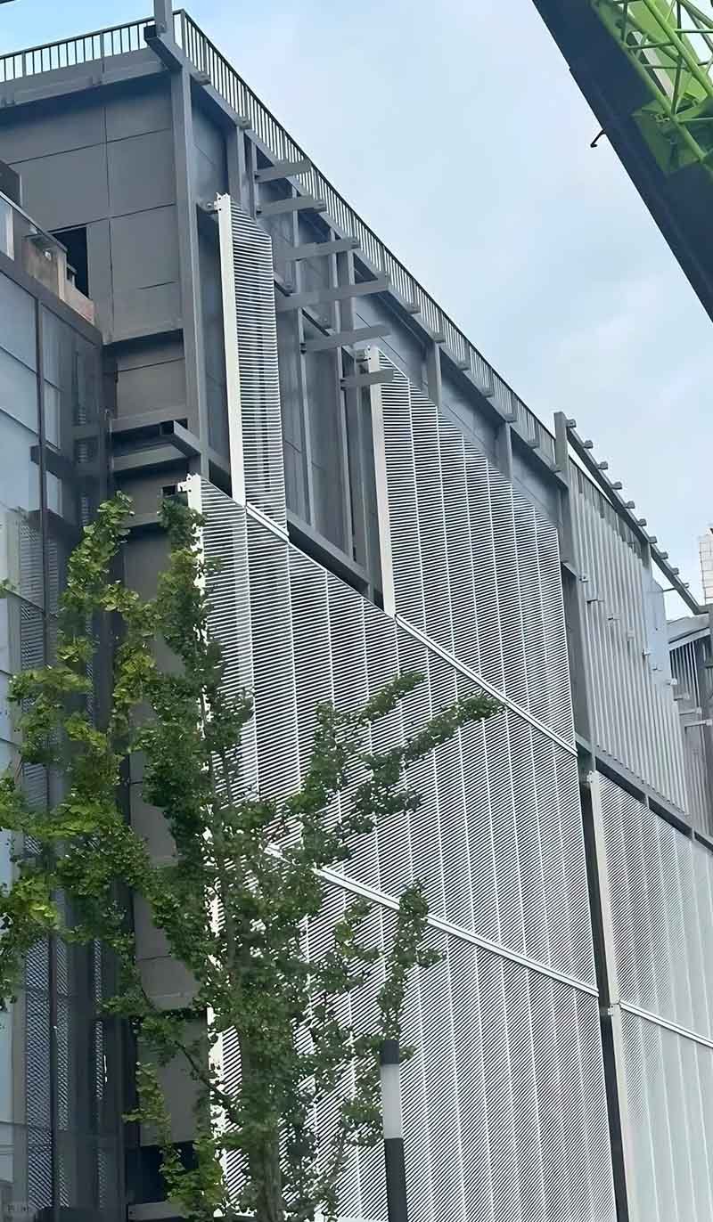 Expanded metal mesh facade cladding panels applied to a modern architectural exterior