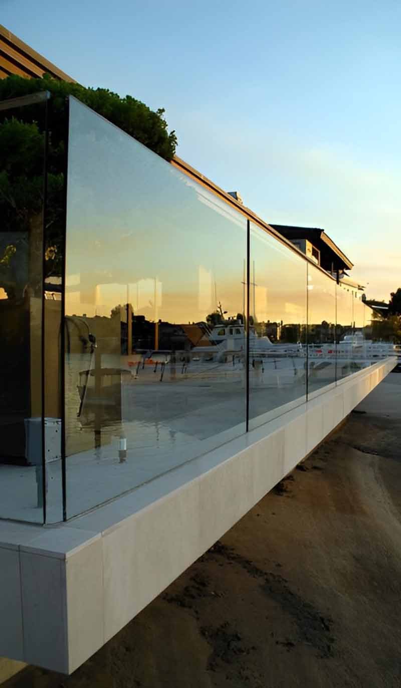 Frameless glass railing system project for architectural applications