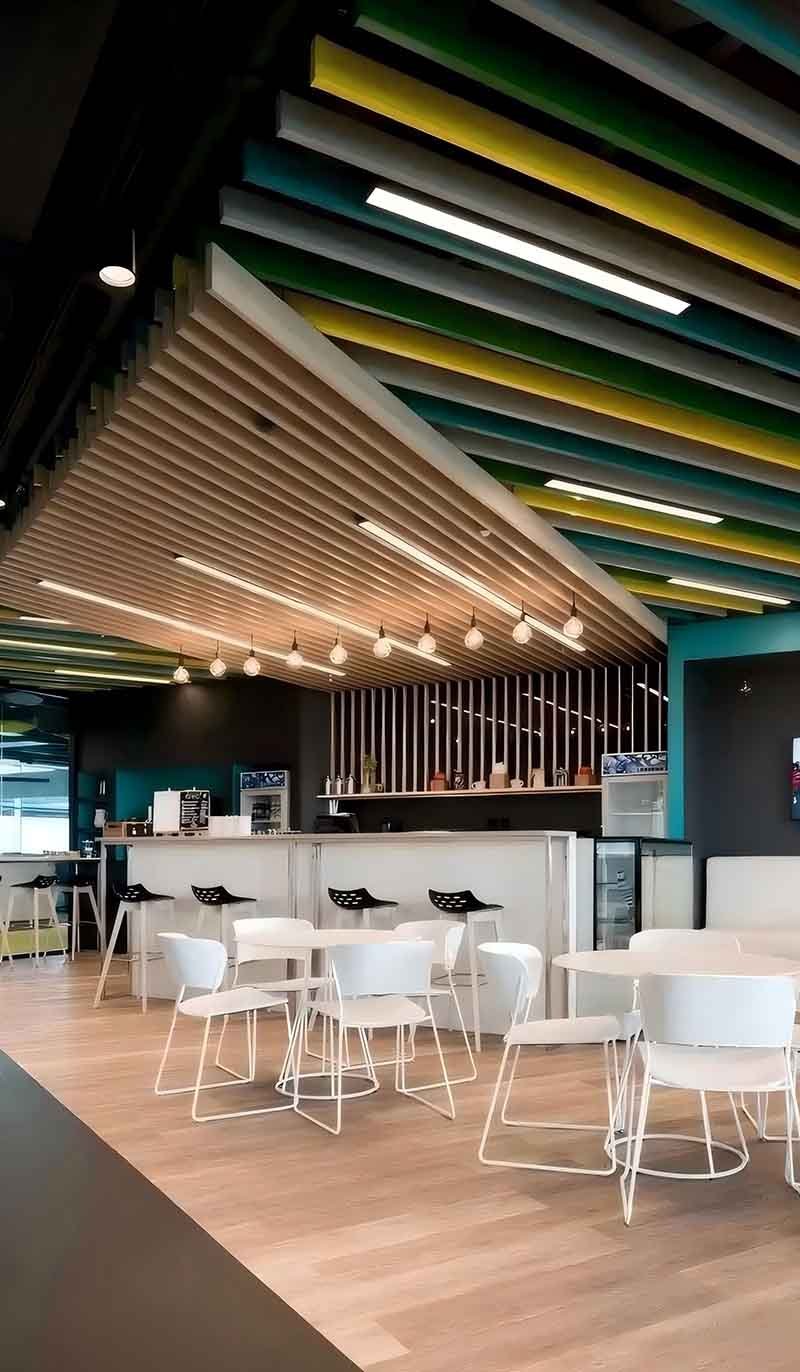 Linear metal ceiling system with linear panels in an architectural interior project