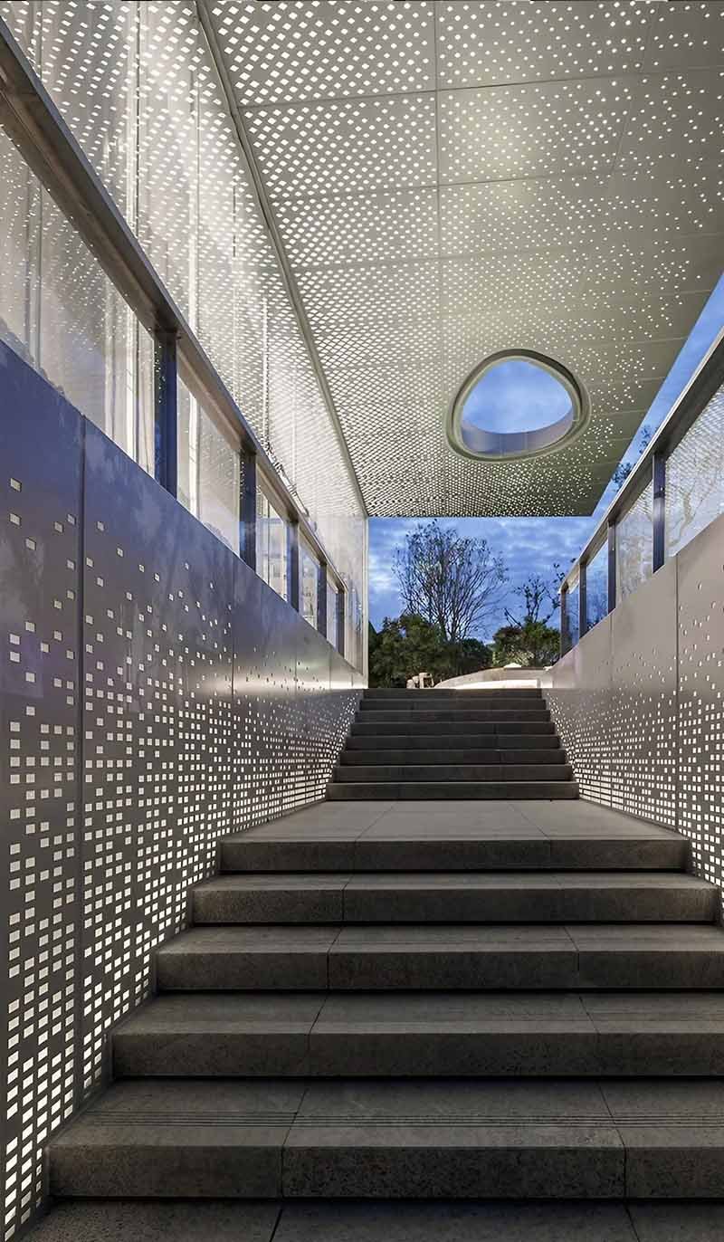 Perforated aluminium ceiling system installed in a modern architectural project