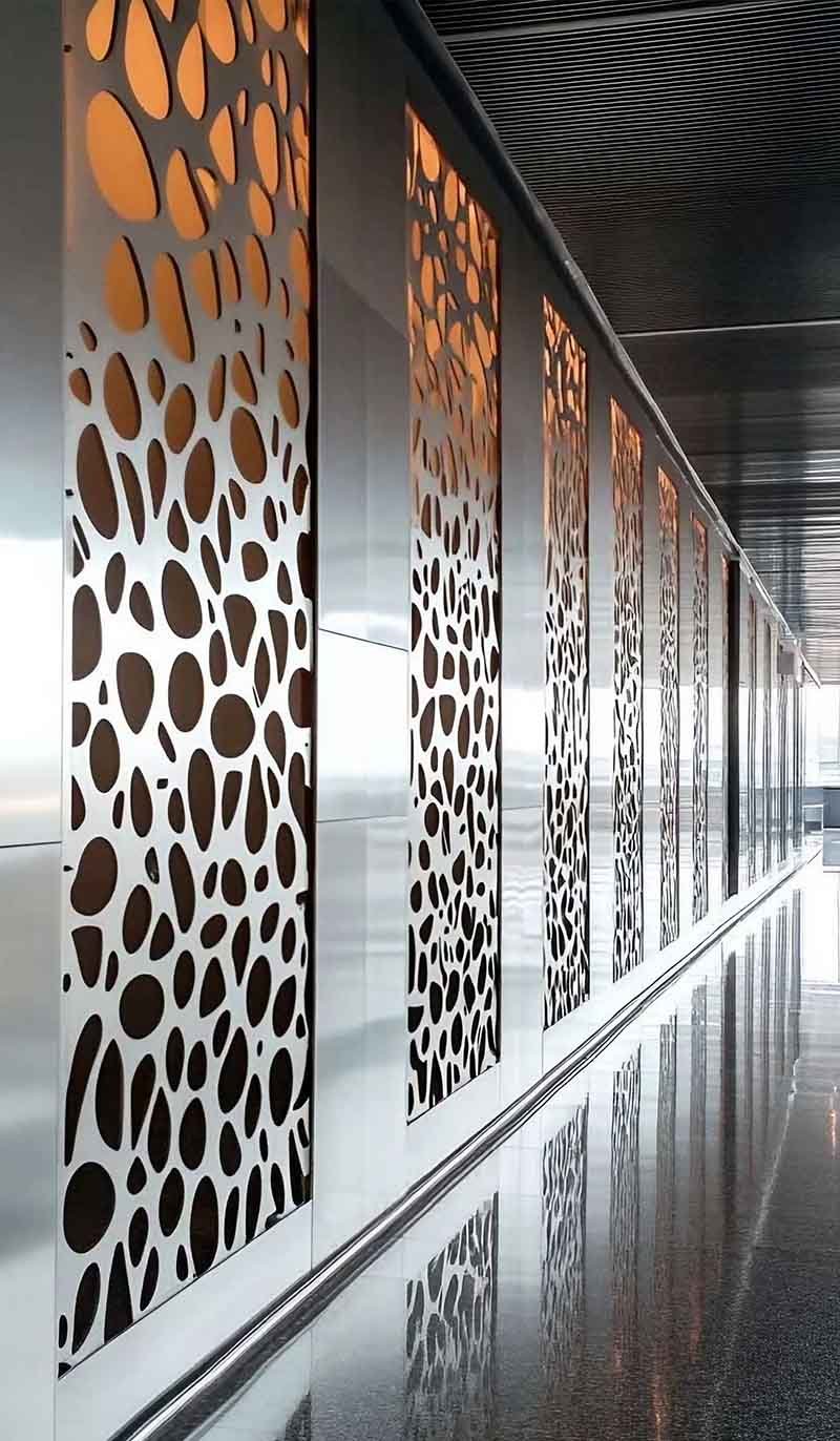 TBK Metal stainless steel facade wall cladding panels installed on modern architectural building exterior with reflective metal surface