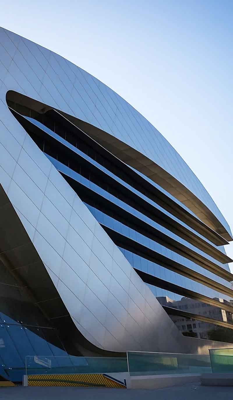 TBK Metal stainless steel facade wall cladding panels installed on modern architectural exterior building surface with sleek metal finish