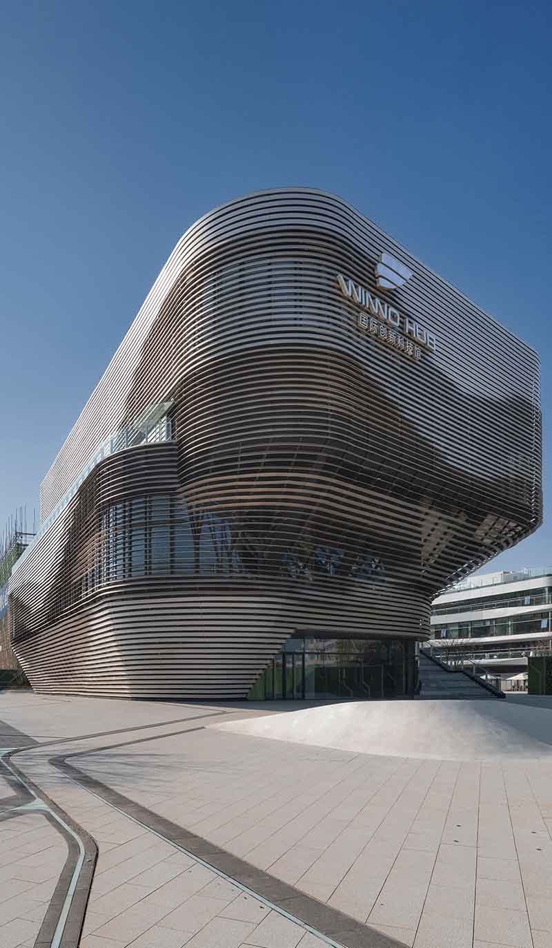 TBK Metal stainless steel facade installed on modern architectural building exterior with sleek metal cladding panels