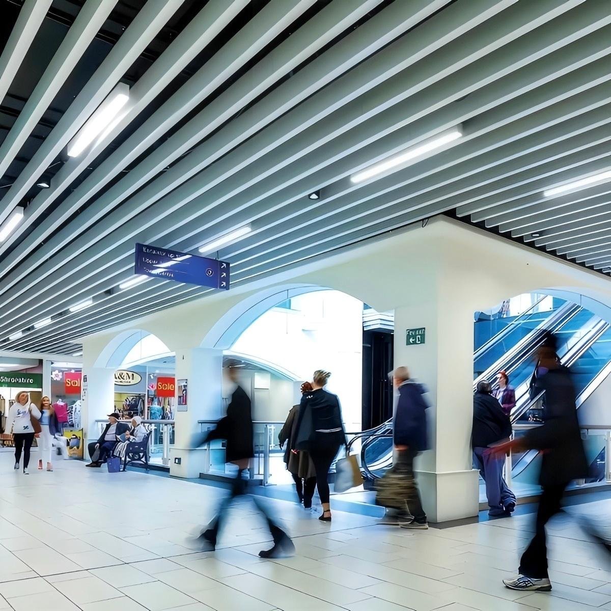 TCS Straight baffle ceiling with linear aluminum profiles for architectural interiors