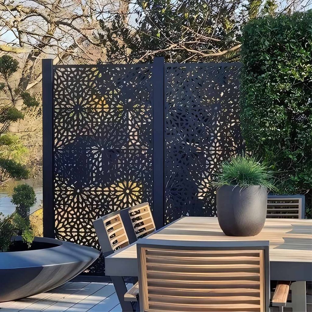 Laser-cut metal privacy screen panels with decorative patterns for outdoor and architectural applications
