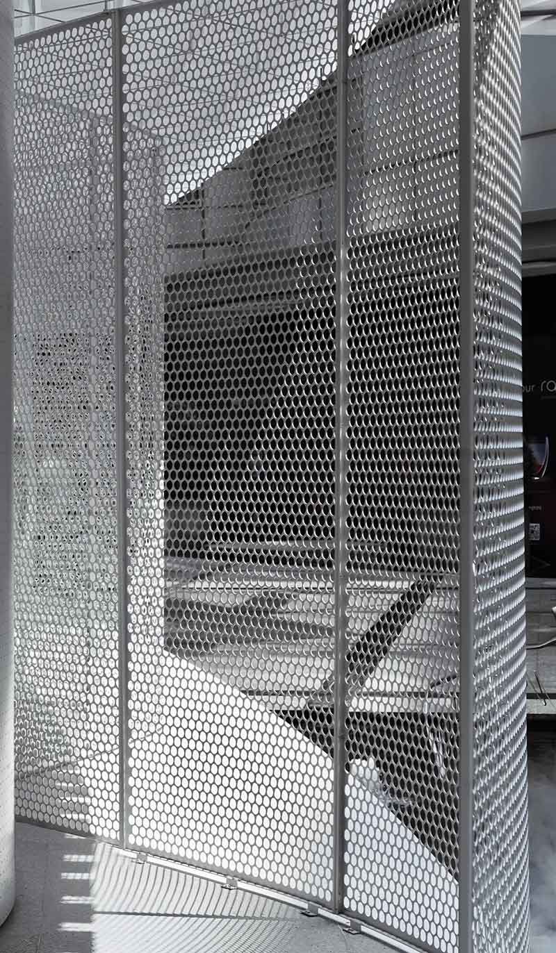 Decorative aluminium perforated metal screen panels installed on a contemporary building facade