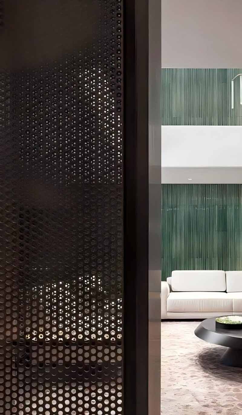 Perforated aluminium screen panels featured in a contemporary architectural facade project