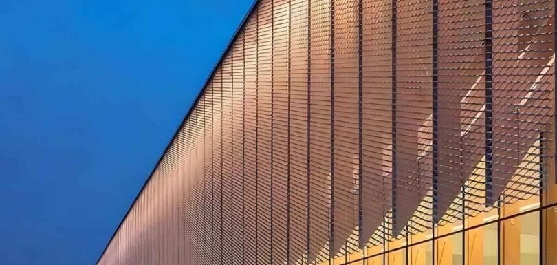 Expanded metal mesh facade enhancing architectural spaces with modern geometric patterns and durable metal construction