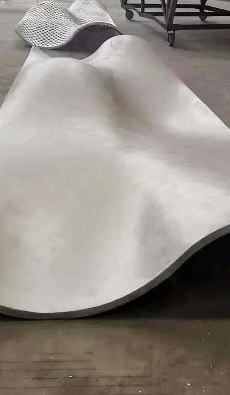 Double-curved aluminium facade panels tailored for distinctive exterior forms and architectural detailing