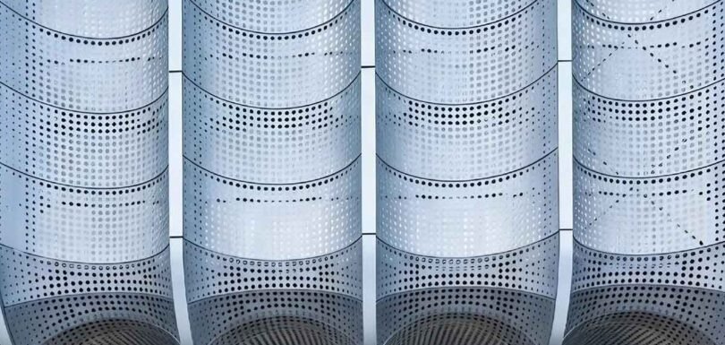 Perforated aluminium panels creating innovative architectural facades with modern patterns and lightweight design features
