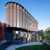 For contemporary buildings, here are the top 10 facade materials to consider. A modern building facade featuring various materials, textures, and design approaches.