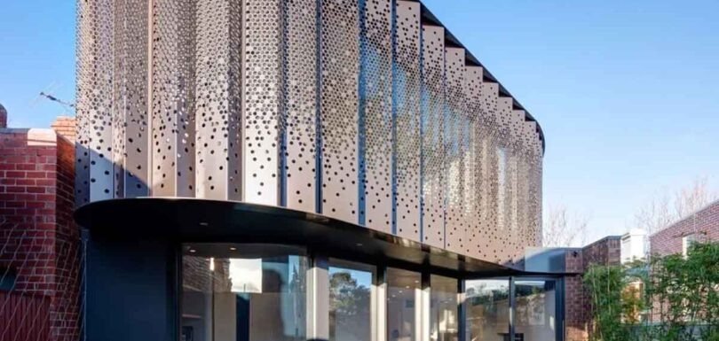 A modern building facade featuring various materials, textures, and design approaches.