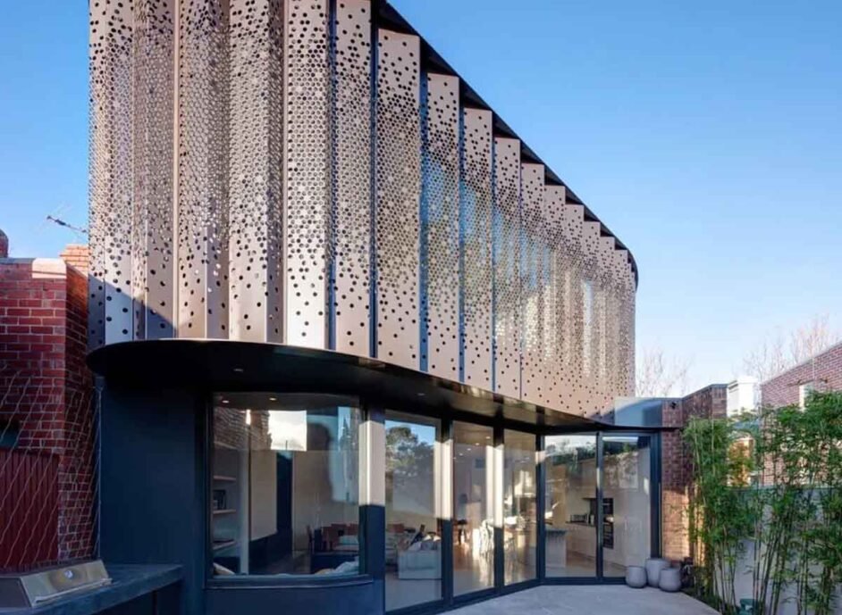 A modern building facade featuring various materials, textures, and design approaches.